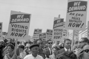 Marchers with signs at the March on Washington 1963